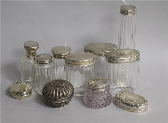 Part sets of silver-mounted glass toilet jars, etc.,